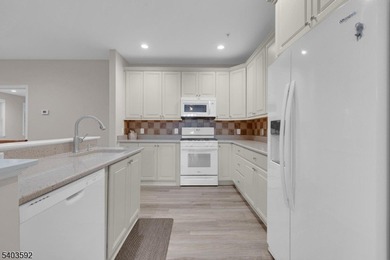 Enjoy effortless living in this desirable active adult community