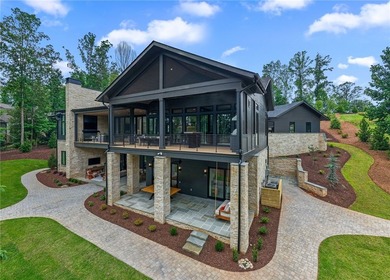 Welcome to an extraordinary lakefront retreat in the prestigious - photo 2