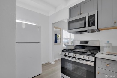 This well-maintained triplex presents a rare opportunity to own - photo 6