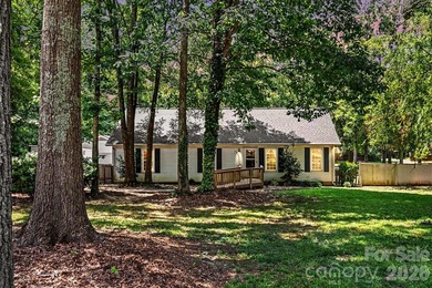 Tucked away on a quiet, tree-lined cul-de-sac, this charming - photo 2
