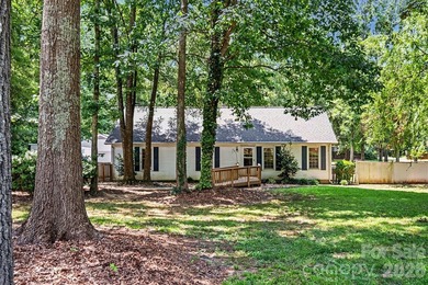 Tucked away on a quiet, tree-lined cul-de-sac, this charming - photo 3