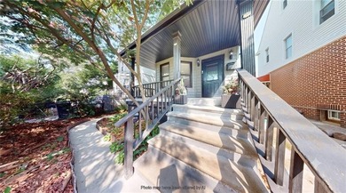 Fully renovated in 2020, this detached single-family home offers - photo 2