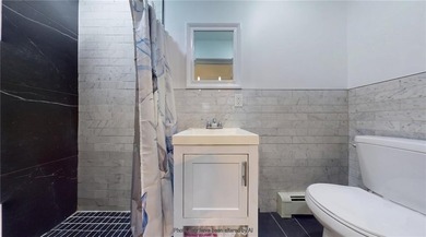 Fully renovated in 2020, this detached single-family home offers - photo 10