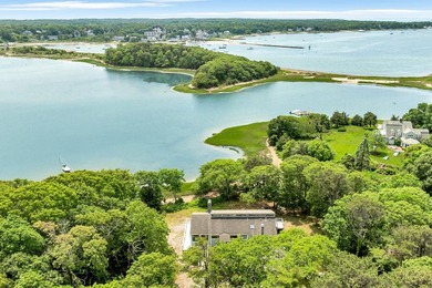 Set on over 3 private acres along the protected shores of - photo 2