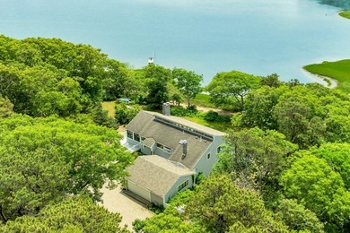 Set on over 3 private acres along the protected shores of - photo 8