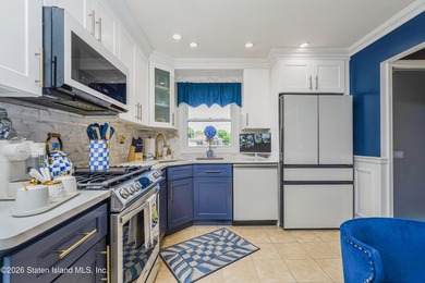 Welcome to 103 Cedar Avenue, a beautifully renovated raised - photo 10