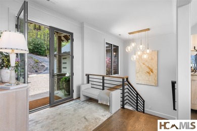 Perched within a quiet cul-de-sac in Lake Toxaway Estates, this - photo 4