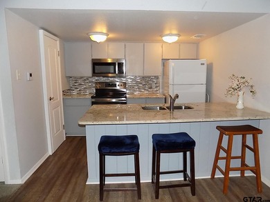 This 2-bedroom, 2 bath condo is a great way to live in the gated - photo 5