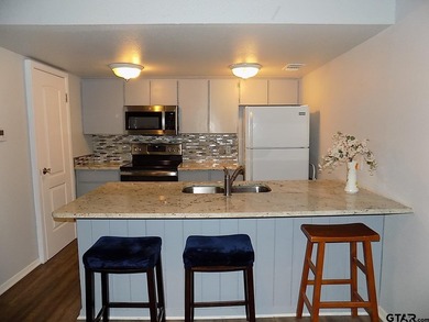 This 2-bedroom, 2 bath condo is a great way to live in the gated - photo 6