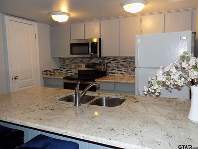 This 2-bedroom, 2 bath condo is a great way to live in the gated - photo 7