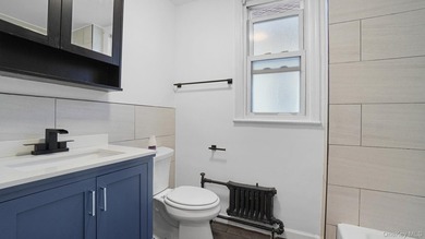 Presenting a beautifully renovated four-level, two-family - photo 14