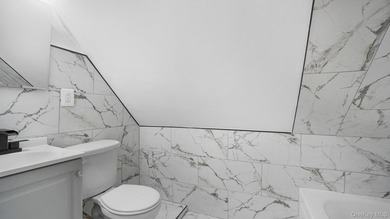 Presenting a beautifully renovated four-level, two-family - photo 19