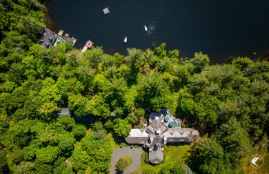 This extraordinary custom-built estate perched along the shores - photo 2