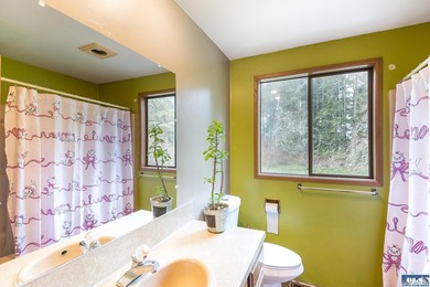 Nestled on 5 private acres in Sequim, this stunning 3 - photo 24