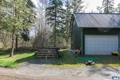 Nestled on 5 private acres in Sequim, this stunning 3 - photo 26