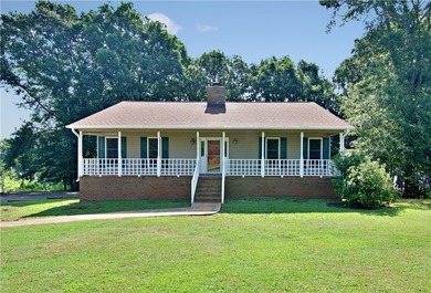 Experience lake living at its finest in this charming 4-bedroom - photo 1