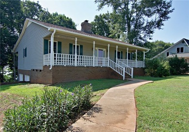 Experience lake living at its finest in this charming 4-bedroom - photo 4