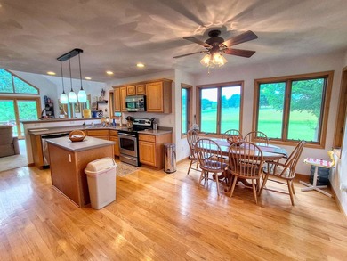 Nestled along a stunning golf course with beautiful views of the - photo 8