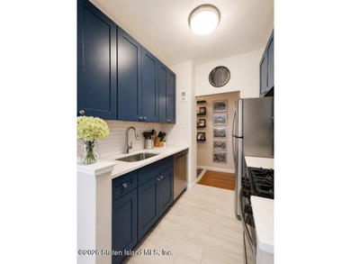 Updated 1-bedroom, 1-bath home featuring a modern kitchen, wood - photo 6
