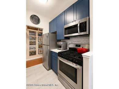 Updated 1-bedroom, 1-bath home featuring a modern kitchen, wood - photo 8
