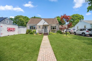 Set on a level, fully fenced property in East Islip, this 3 - photo 1