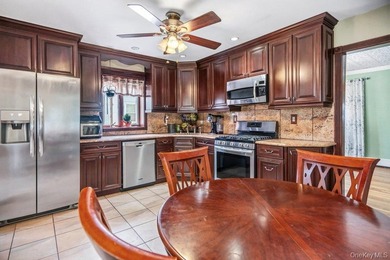Set on a level, fully fenced property in East Islip, this 3 - photo 10