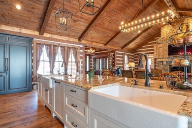 This one-of-a-kind custom log home, built in 2015, blends luxury - photo 7