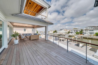 Welcome to 55 Walnut Road, a stunning bayfront masterpiece. This