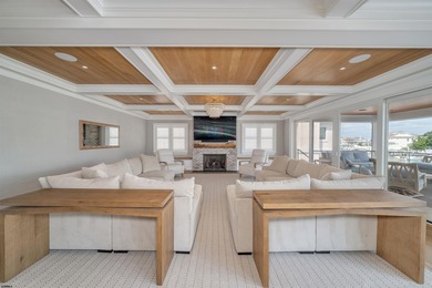 Welcome to 55 Walnut Road, a stunning bayfront masterpiece. This