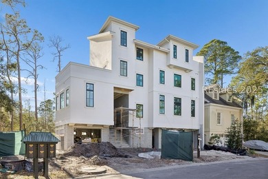 Currently under construction, this modern custom townhome offers