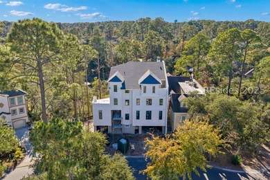 Currently under construction, this modern custom townhome offers