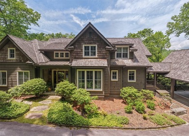 Nestled within the prestigious Wade Hampton Golf Club and just - photo 2