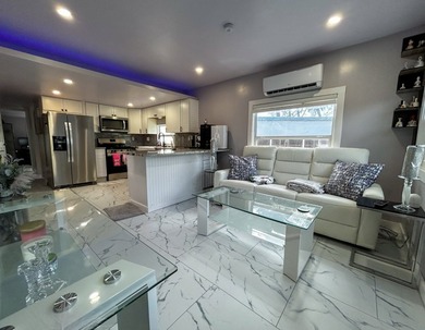 This glamorous waterfront home has been completely reimagined - photo 7