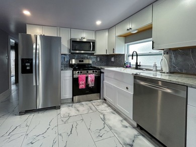 This glamorous waterfront home has been completely reimagined - photo 10