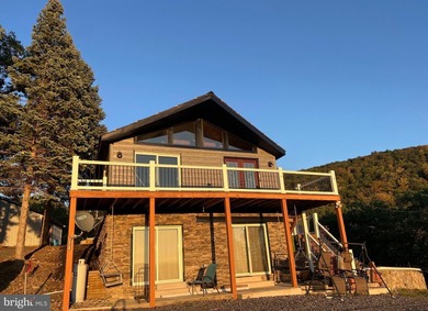 REDUCED!!! PRICE FIRM! This cabin is uniquely perched atop a - photo 1