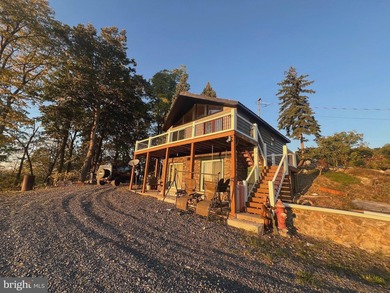 REDUCED!!! PRICE FIRM! This cabin is uniquely perched atop a - photo 3