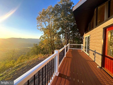 REDUCED!!! PRICE FIRM! This cabin is uniquely perched atop a - photo 4
