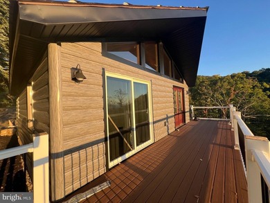 REDUCED!!! PRICE FIRM! This cabin is uniquely perched atop a - photo 6