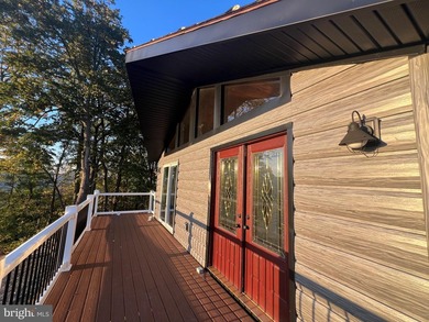 REDUCED!!! PRICE FIRM! This cabin is uniquely perched atop a - photo 8