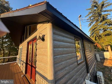 REDUCED!!! PRICE FIRM! This cabin is uniquely perched atop a - photo 9