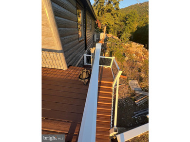 REDUCED!!! PRICE FIRM! This cabin is uniquely perched atop a - photo 10