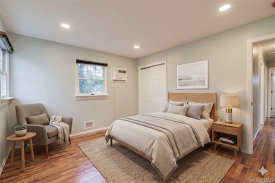 Nestled on a quiet, tree-lined cul-de-sac in Northport, this - photo 9