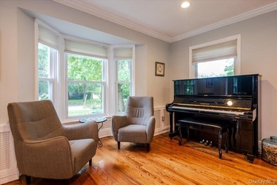 Welcome to this sunlit all brick center hall colonial located in - photo 8