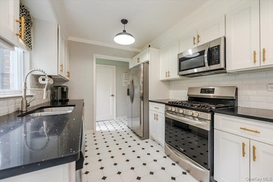 Welcome to this sunlit all brick center hall colonial located in - photo 9