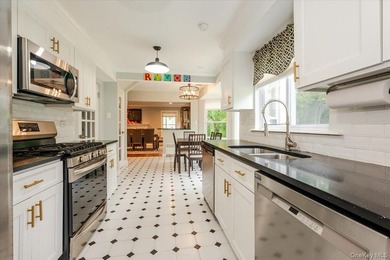 Welcome to this sunlit all brick center hall colonial located in - photo 10