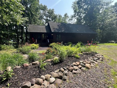 Gorgeous, log-sided property on Slim Lake at the end of a quiet