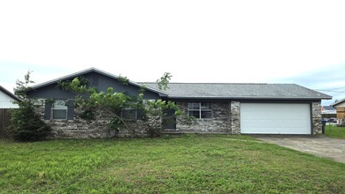 This 3-bedroom, 2-bath home with a garage and fenced backyard - photo 2