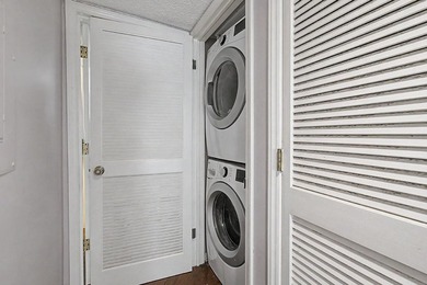 Welcome to this top-floor end-unit condo in Cypress Bay, located - photo 12