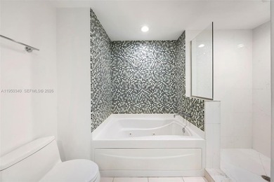 Enjoy breathtaking bay, river, and city views from this spacious