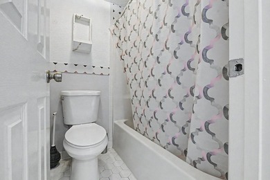 Welcome to this top-floor end-unit condo in Cypress Bay, located - photo 14